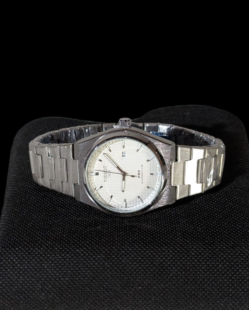 Reloj de acero TISSOT para hombres, modelo PRX Powermatic 80 automático con dial texturizado y brazalete integrado.